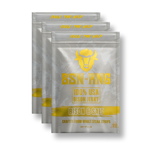 Three packages of BSN-KING 100% USA Bison Jerky with gold text on a white background